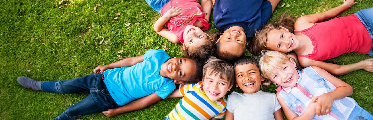 A group of children linking arms