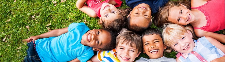 A group of children linking arms