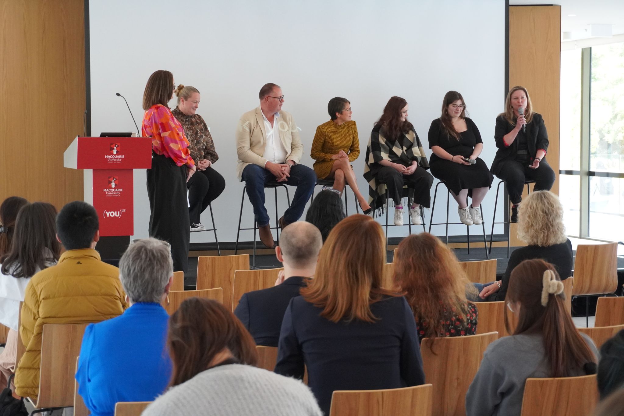 Panellists face the audience at Women in Cybersecurity event