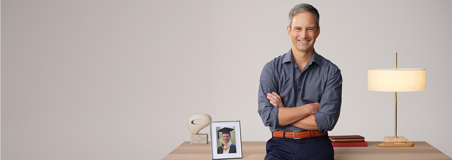 Professional picture of man standing in front of a table