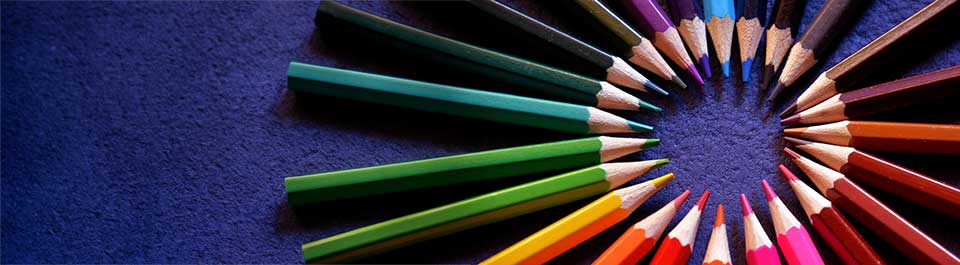 Coloured pencils all pointing inwards