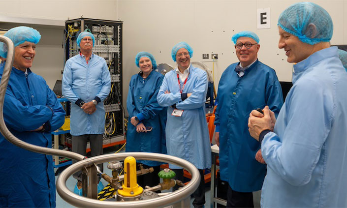 Leadership team inspecting the DIRAC instrument