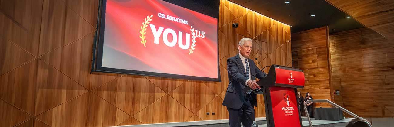 Man giving a celebratory presentation