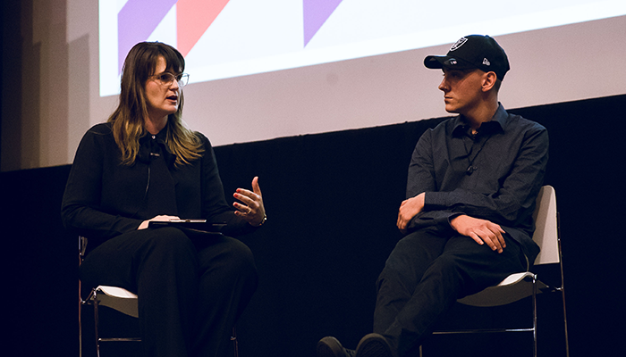 Holly in conversation with Dylan Voller at an event on Universal Children's Day 2018.