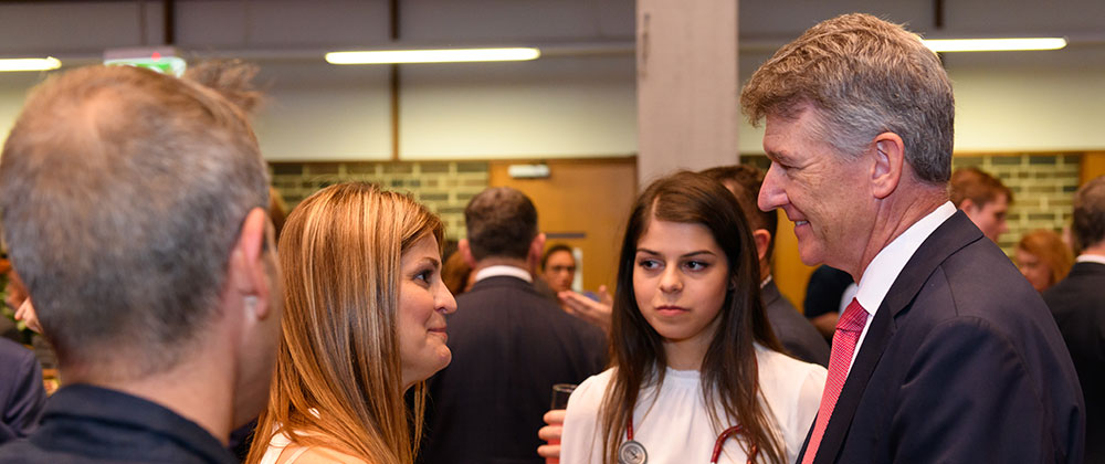 Four people talking in a group