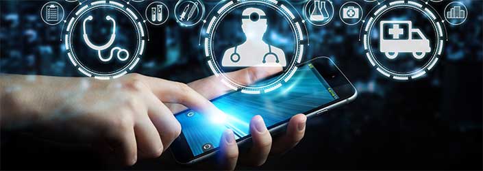 A person's hand holding a mobile phone with the other hand touching the screen with the simulation of medical icons floating above the phone screen