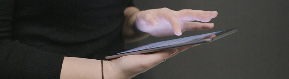 A person using a touch screen device.
