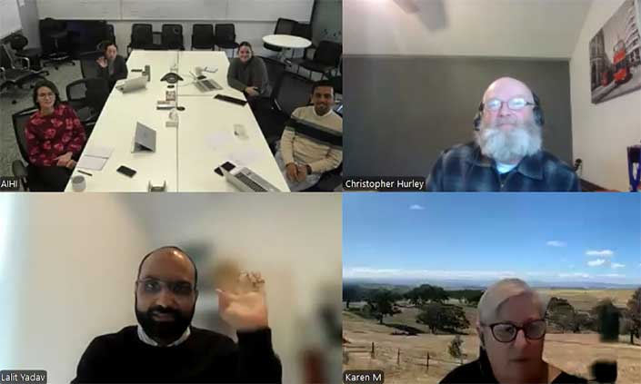 A screenshot from the video showing four panels with people talking