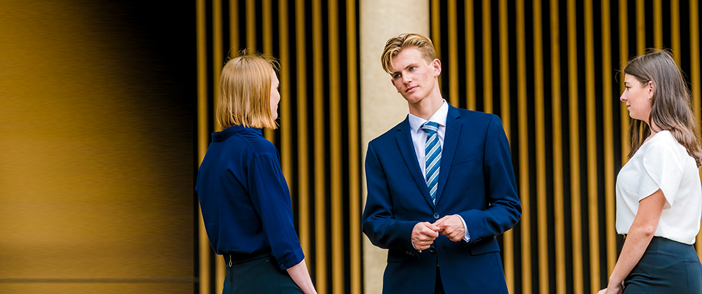 Three students talking