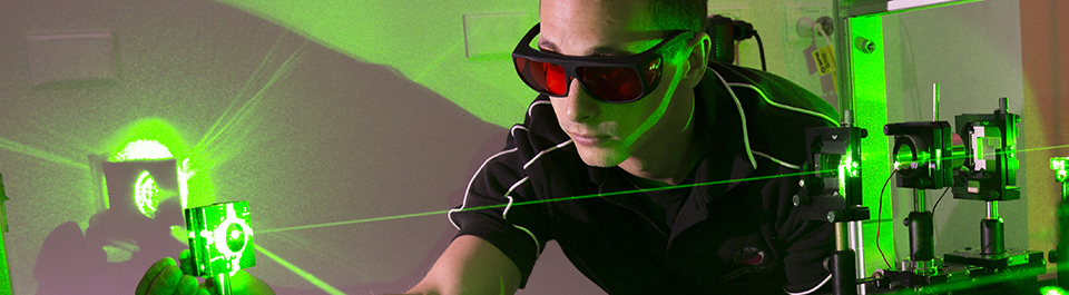 Student aligning lasers