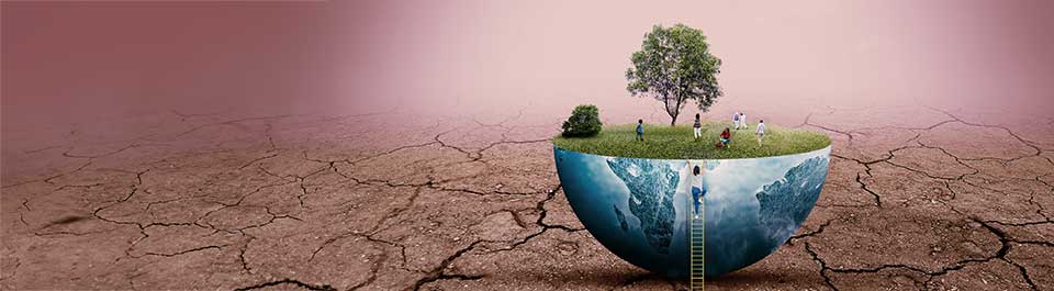 A hemisphere, blue continents on its outer surface, grass and a tree growing out of its flat top surface. A person climbs its side using a ladder, and several others sit on the grass. The background is drought-stricken cracked dirt.