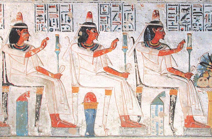 Wall art from Theban Tomb TT 148 depicting three seated male figures.