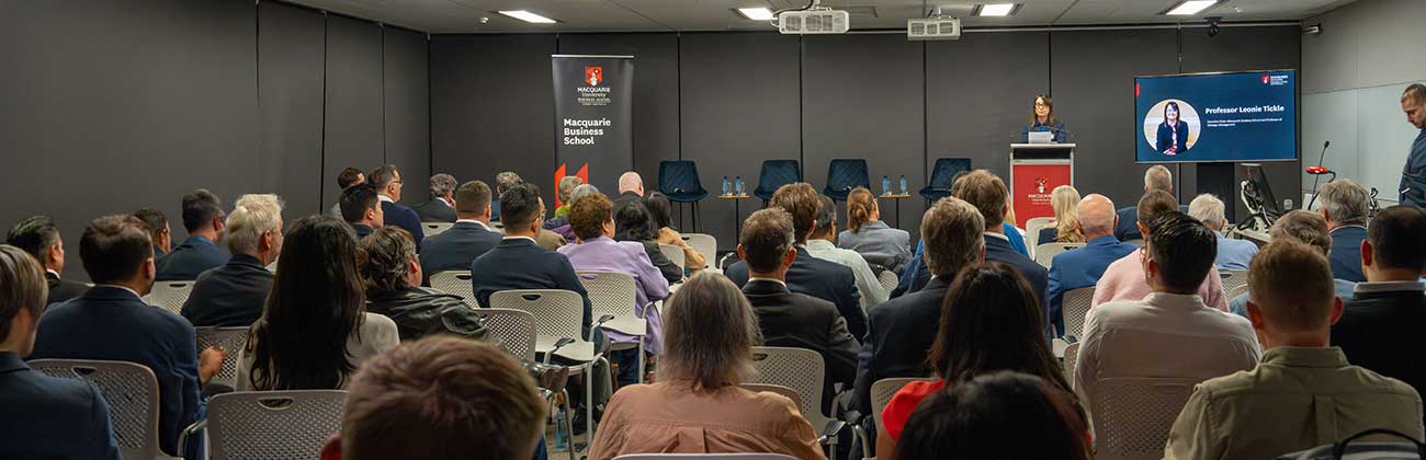 A presentation being presented in a room full of people