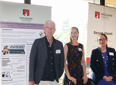 Professor David Raftos, Professor Melanie Bishop and another member of their research team standing in front of a poster about this project.