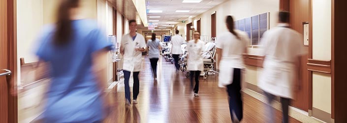 Action shot of a busy hospital corridor