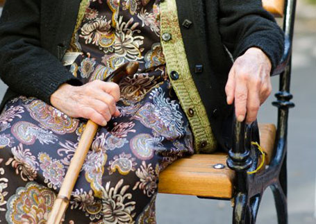 An old woman sitting in a chair