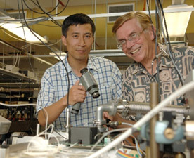 Yabai He and Brian Orr preparing to align an infrared laser beam