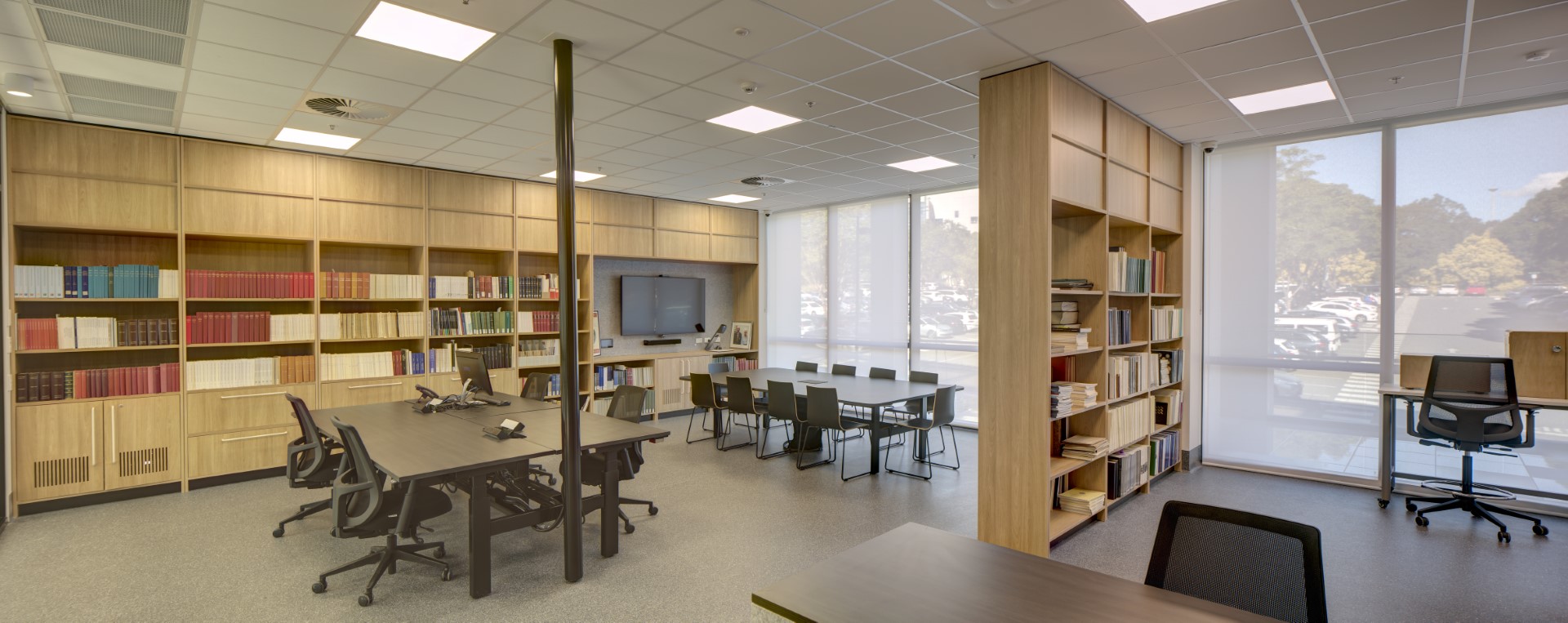 Shelves of the ACANS library with two workstations in centre of image