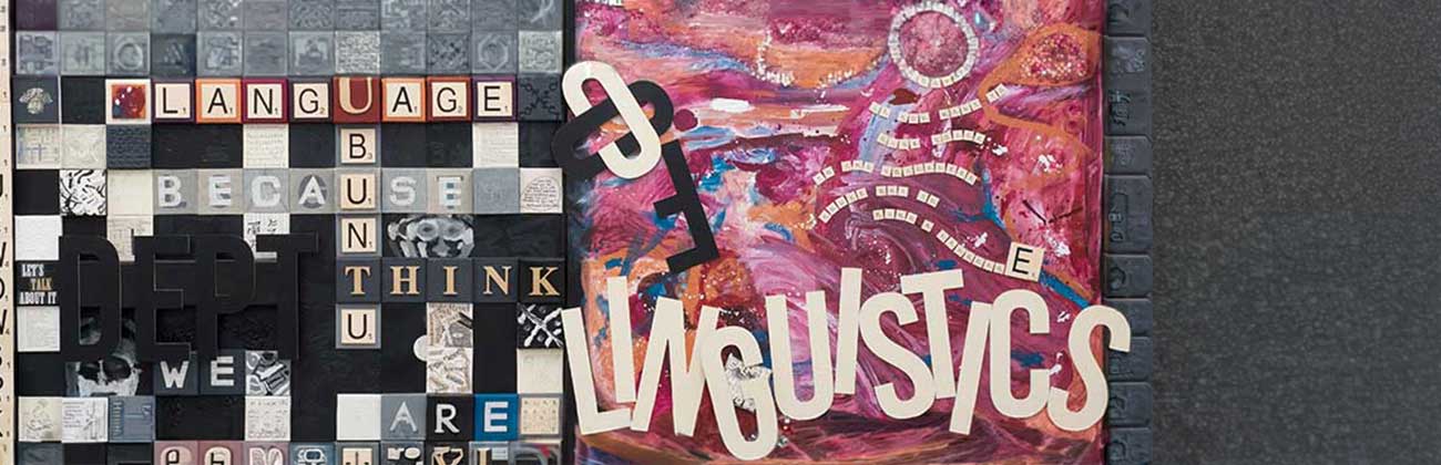 A painting that has scrabble letters making words like Language, Think, Because and we are, as well as the words Dept of Linguistics painted next to them with swirls of painted colour around the words