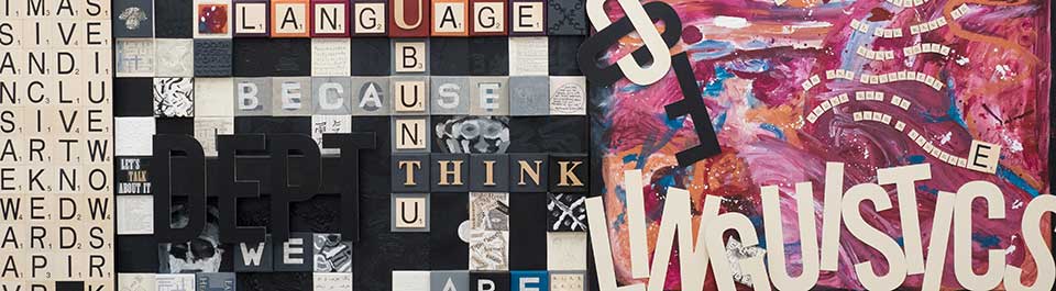 A painting that has scrabble letters making words like Language, Think, Because and we are, as well as the words Dept of Linguistics painted next to them with swirls of painted colour around the words
