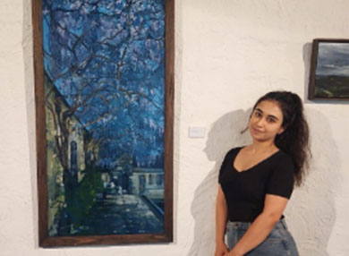 Nazli with paintings