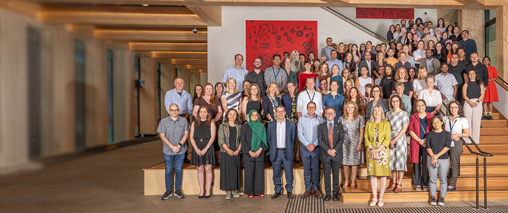 A large group of AIHI members standing together.