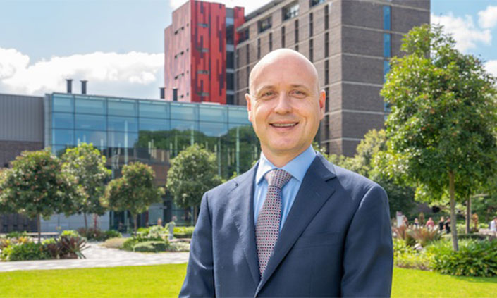 Photo of Samuel Muller with Science and Engineering behind