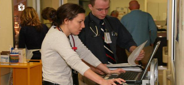 Two people using a computer