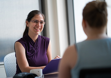 A clinician talking to a patient