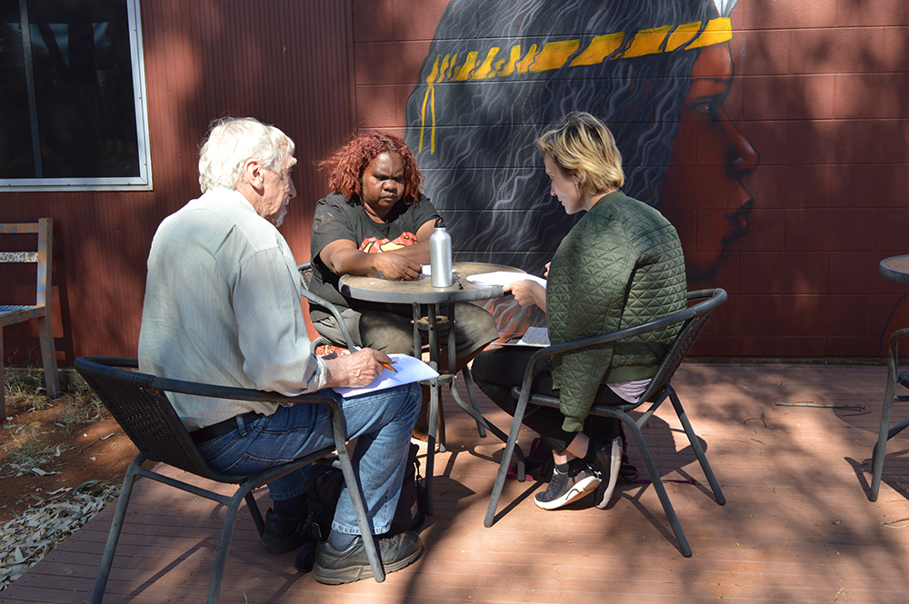 David Throsby and Katya Peteskaya discuss the survey with Keturah Zimran, a senior artist at Ikuntji Artists, Haasts Bluff, NT