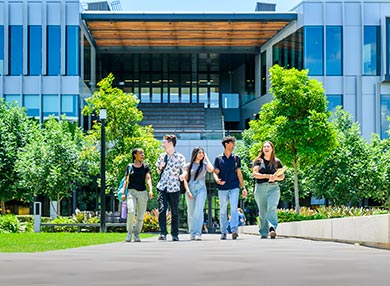 Five students walking through the Central Courtyard.