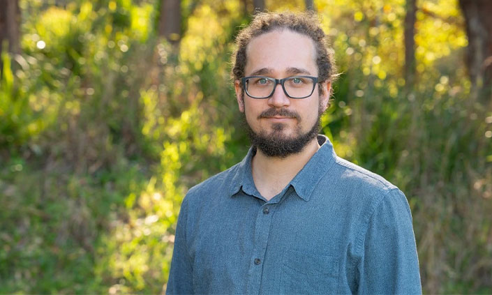 Photo of Dr Théotime Colin in front of trees
