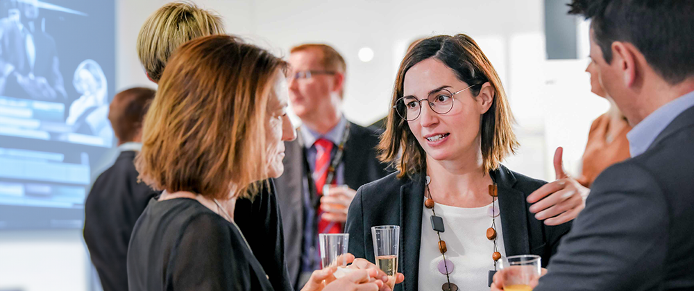 Image of people networking at an event
