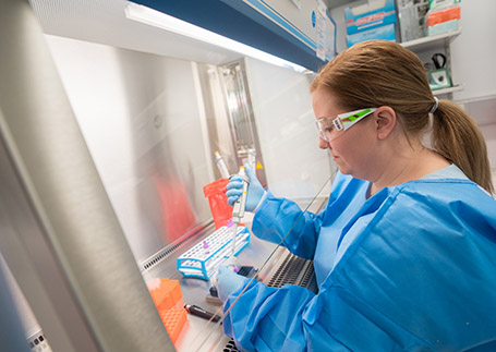 A clinician working in a lab