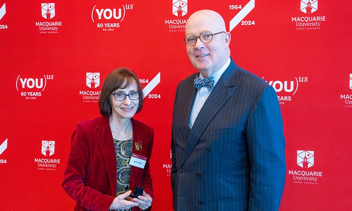 Vice-Chancellor Professor S Bruce Dowton presenting the Lincoln Legacy Society pin to Sylvia Tropiano
