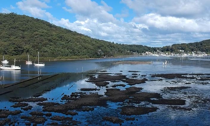 Water landscape with hills in the background