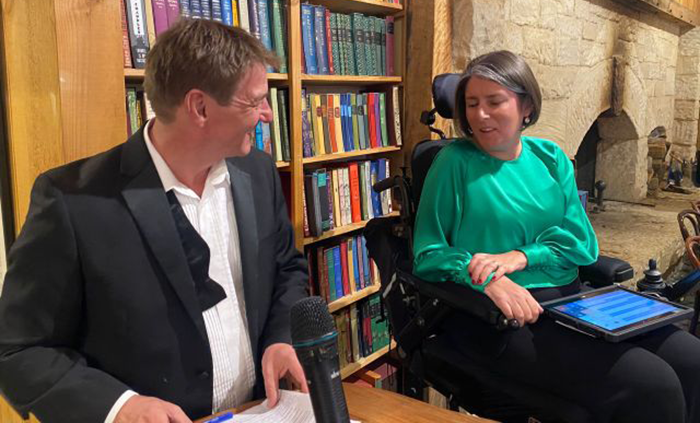 Man interacting with women in wheelchair