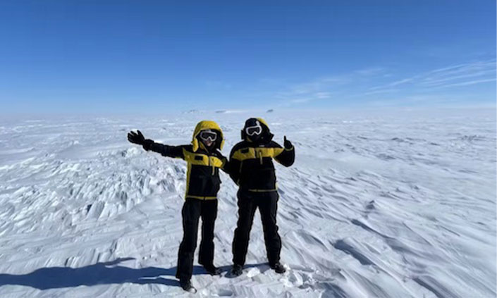 Antarctic Researchers posing in the snow