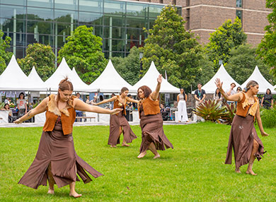 Four members of Dharug group the Jannawi Dance Clan performing a traditional dance.