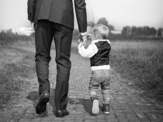 Father and son walking together. Photo by Sabine Van Straaten on Unsplash