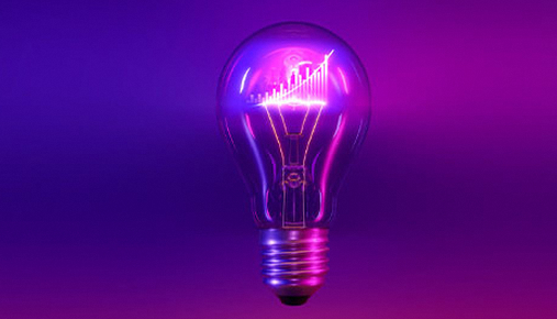 a lightbulb with a neon background