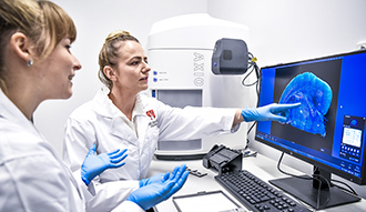 Two scientists looking at a scan. Image by Morris McLennan