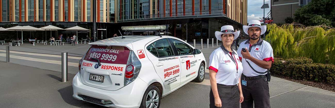 A security car and two security officers