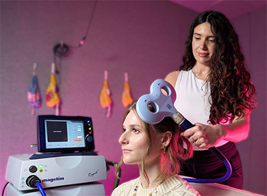 A technician scanning a research participant's head.