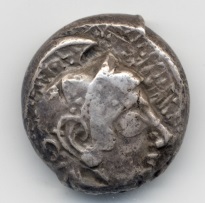 Coin from Poseidonia showing Poseidon and ketos on obverse, with bull on reverse | © ACANS SNG Gale 716o