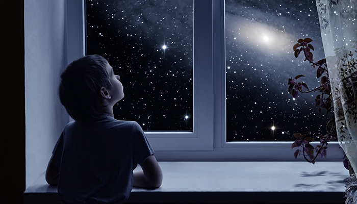 Child looking at stars