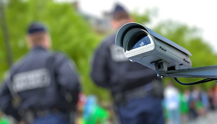 Police with surveillance camera