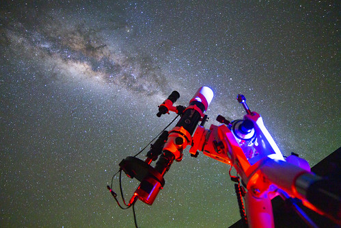 Astronomy on show - telescope against a starry sky