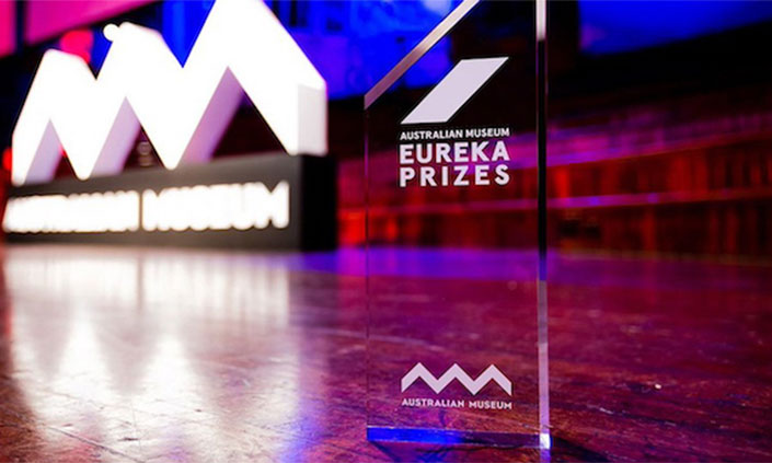 Close up of the glass eureka award on stage