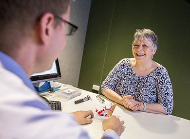 A doctor talking to a female patient